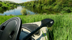 kayak new lake borrow pit clear water grass big hill
